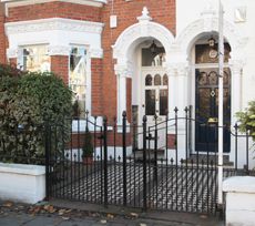 Two smart period houses in Bromwood Road, London SW17 with it's smart, period front garden.